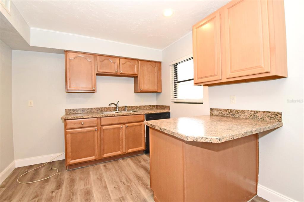 2148 Ridge Drive Winter Park, FL 32792 - Photo 2 of 33 a kitchen with stainless steel appliances granite countertop a sink and a white cabinets