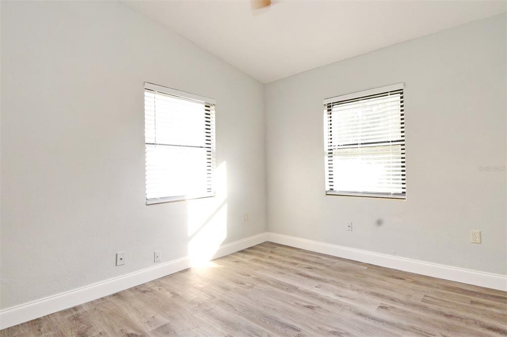 2148 Ridge Drive Winter Park, FL 32792 - Photo 11 of 33 an empty room with wooden floor and windows