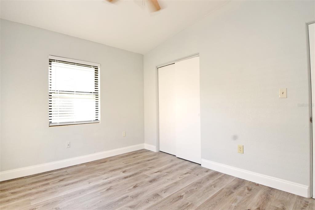 2148 Ridge Drive Winter Park, FL 32792 - Photo 12 of 33 an empty room with wooden floor and windows