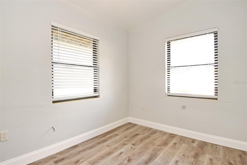 2148 Ridge Drive Winter Park, FL 32792 - Photo 14 of 33 a view of an empty room with wooden floor and a window