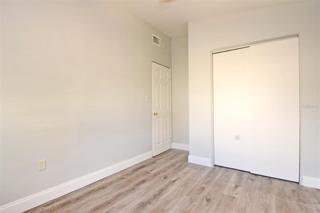 2148 Ridge Drive Winter Park, FL 32792 - Photo 15 of 33 a view of an empty room with wooden floor and a window