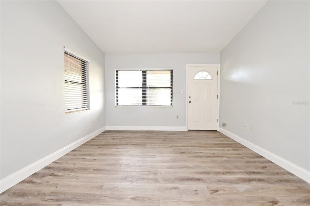 2148 Ridge Drive Winter Park, FL 32792 - Photo 21 of 33 an empty room with wooden floor and windows