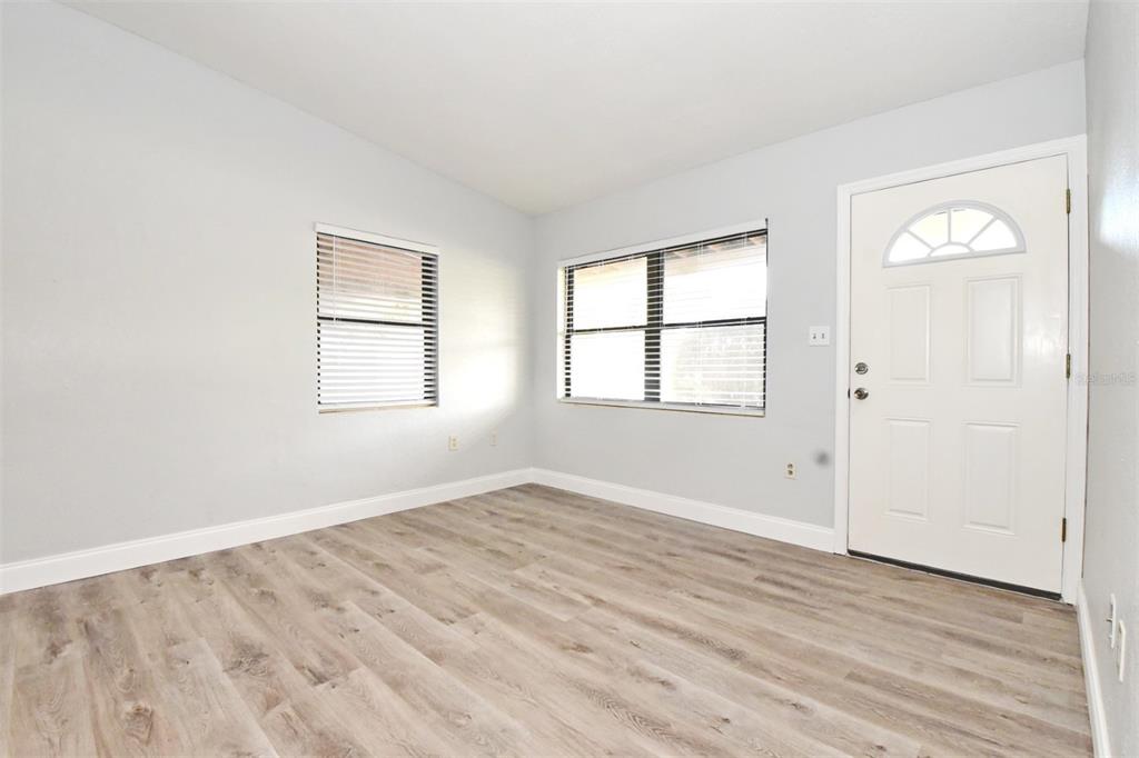 2148 Ridge Drive Winter Park, FL 32792 - Photo 22 of 33 an empty room with wooden floor and windows