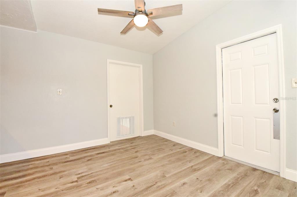 2148 Ridge Drive Winter Park, FL 32792 - Photo 23 of 33 an empty room with wooden floor closet and fan