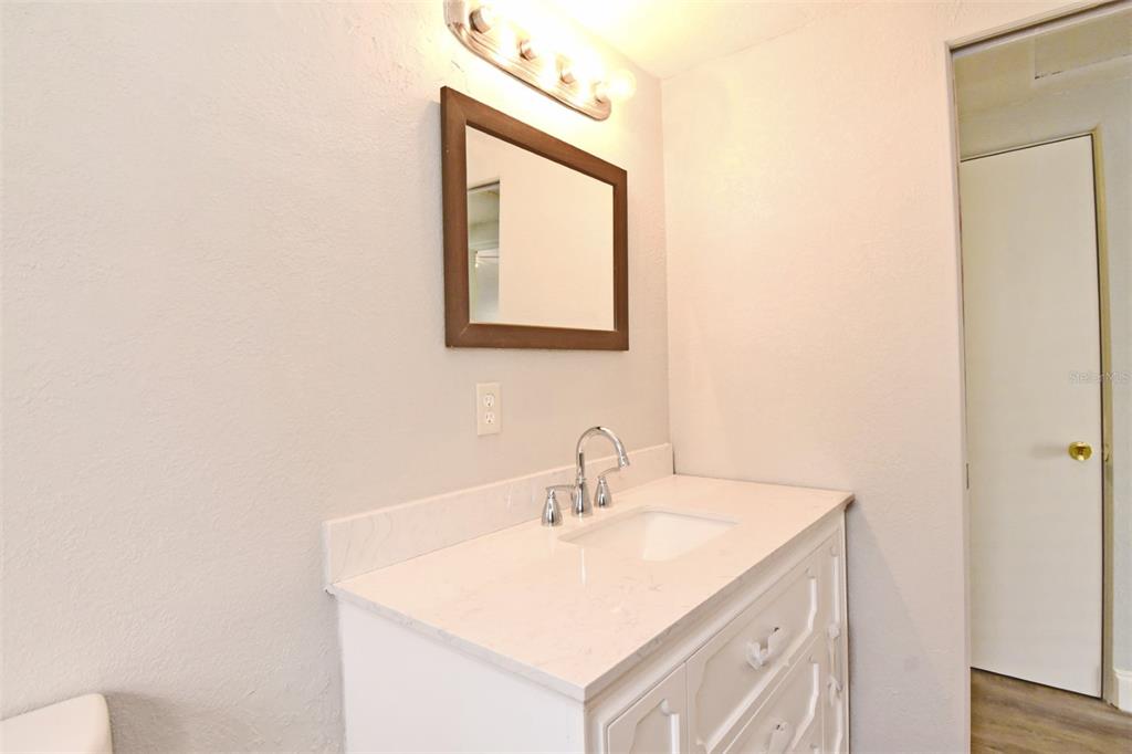 2148 Ridge Drive Winter Park, FL 32792 - Photo 8 of 33 a bathroom with a sink and a mirror