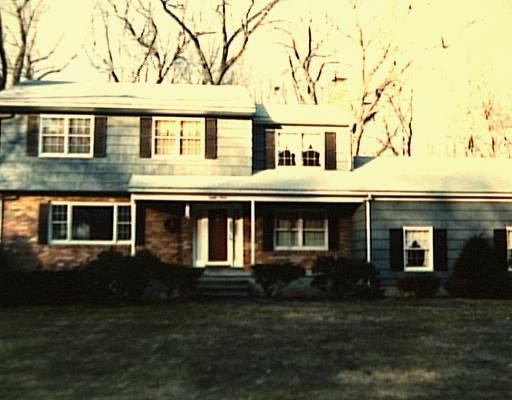 83 Stoneleigh Road Trumbull, CT 06611 - Photo 1 of 1 a front view of a house with a garden