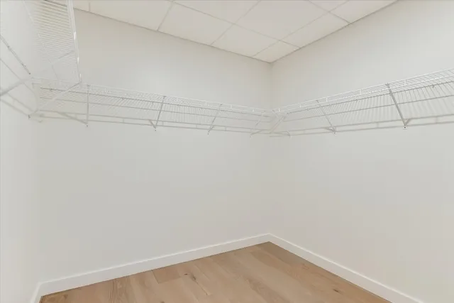 a bathroom with a granite countertop sink toilet and a mirror