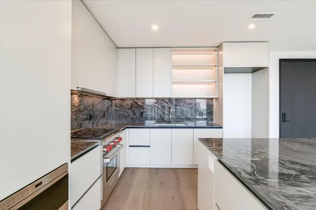 a view of an empty room with windows