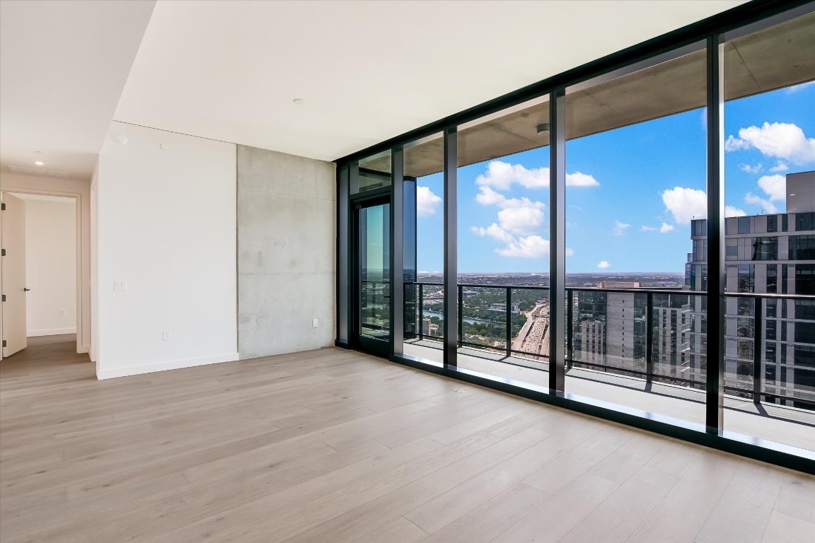 610 Davis Street, Unit 4602 Austin, TX 78701 - Photo 5 of 35 a view of an empty room with windows
