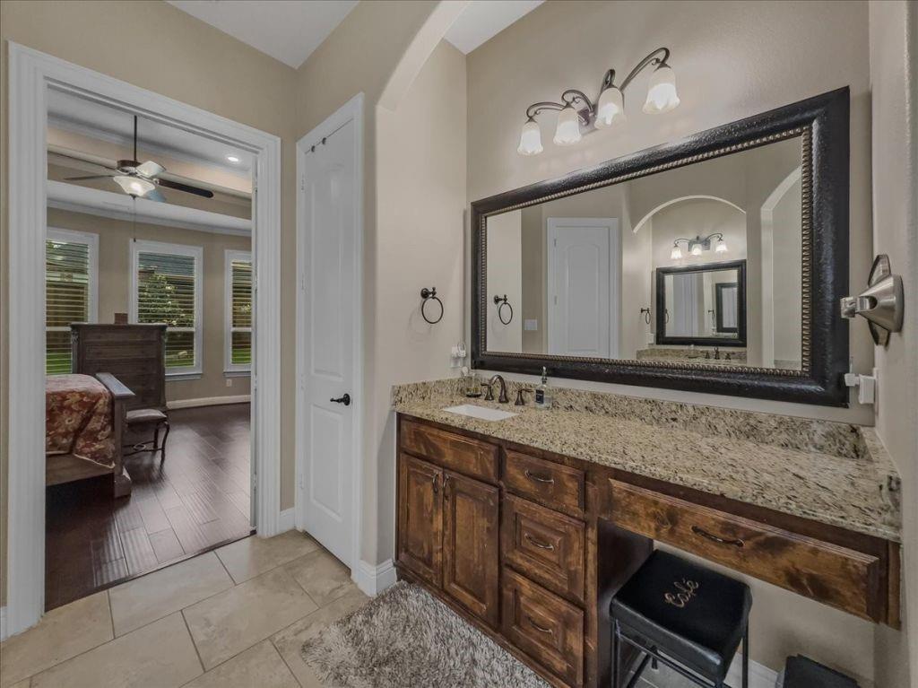 2832 Mona Vale Road Trophy Club, TX 76262 - Photo 21 of 37 a bathroom with a granite countertop sink vanity and a mirror
