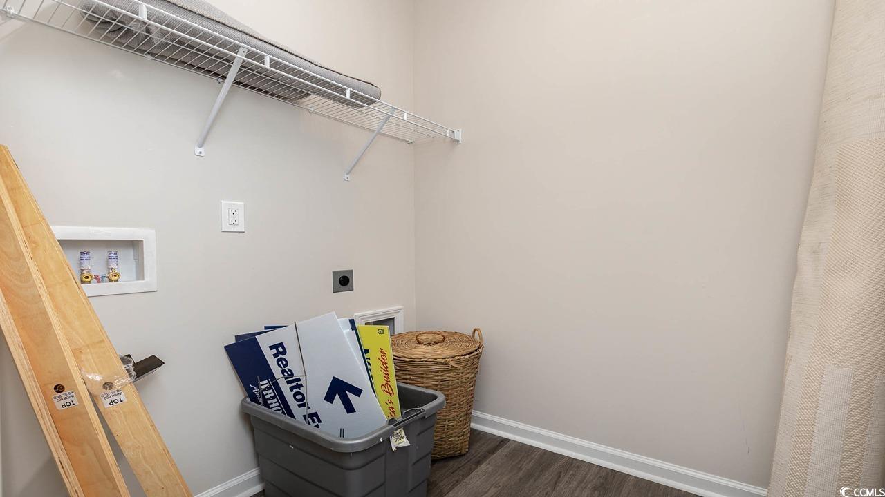 7383 Meadow Walk Loop Loris, SC 29569 - Photo 27 of 29 Washroom featuring dark wood-type flooring, washer hookup, baseboards, hookup for an electric dryer, and laundry area