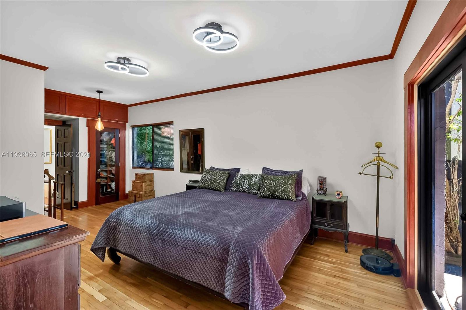 452 Southwest 21st Road Miami, FL 33129 - Photo 18 of 51 a spacious bedroom with a bed and large windows