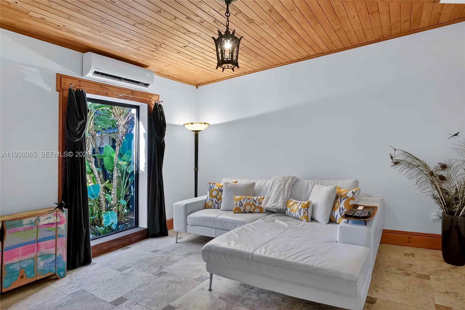 452 Southwest 21st Road Miami, FL 33129 - Photo 25 of 51 a living room with furniture and a window