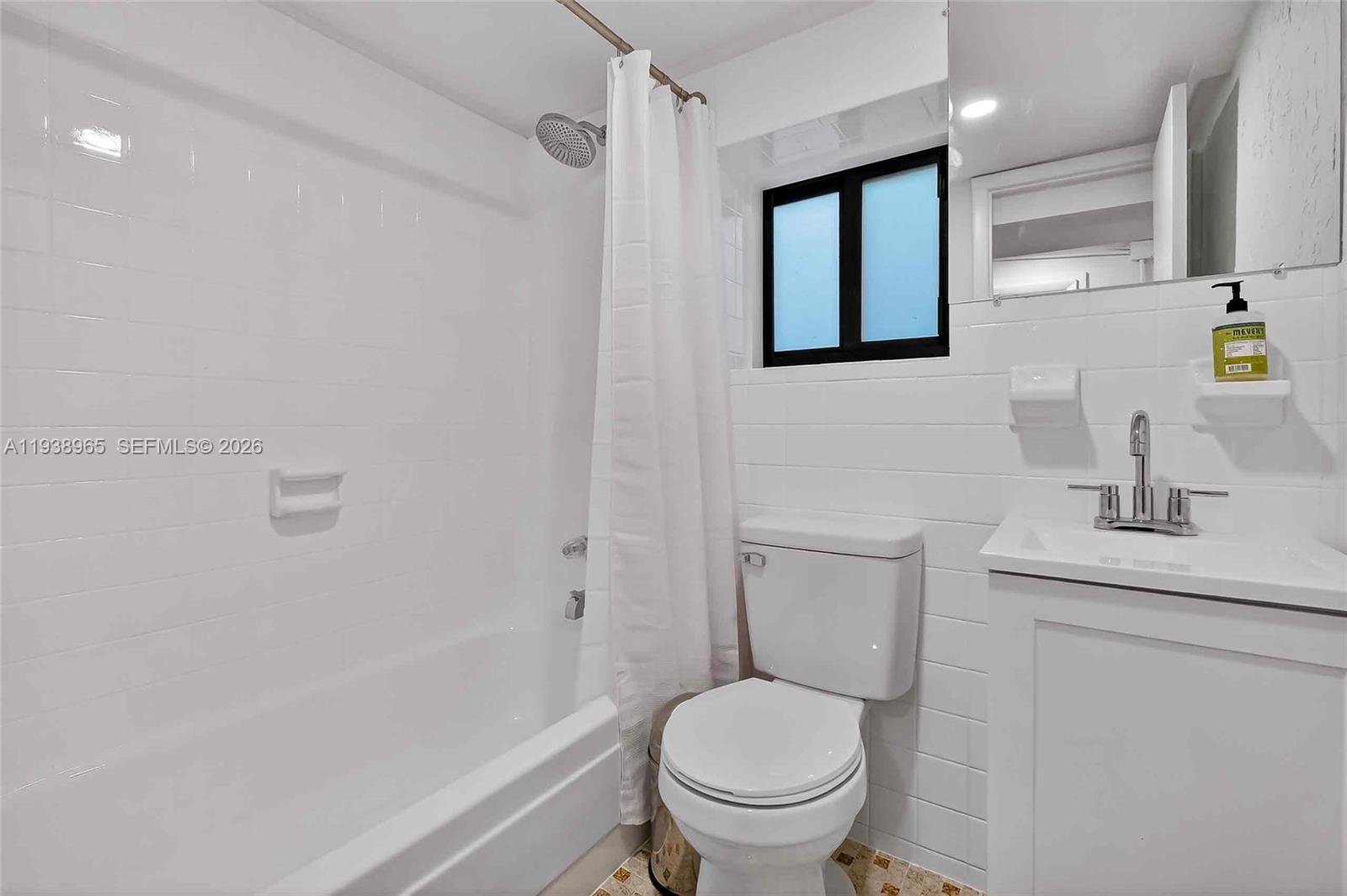 452 Southwest 21st Road Miami, FL 33129 - Photo 38 of 51 a white toilet sitting next to a bathroom sink