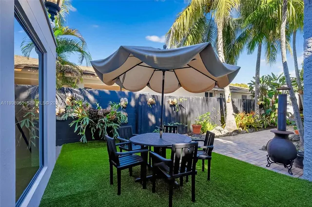 a view of an outdoor sitting area with furniture