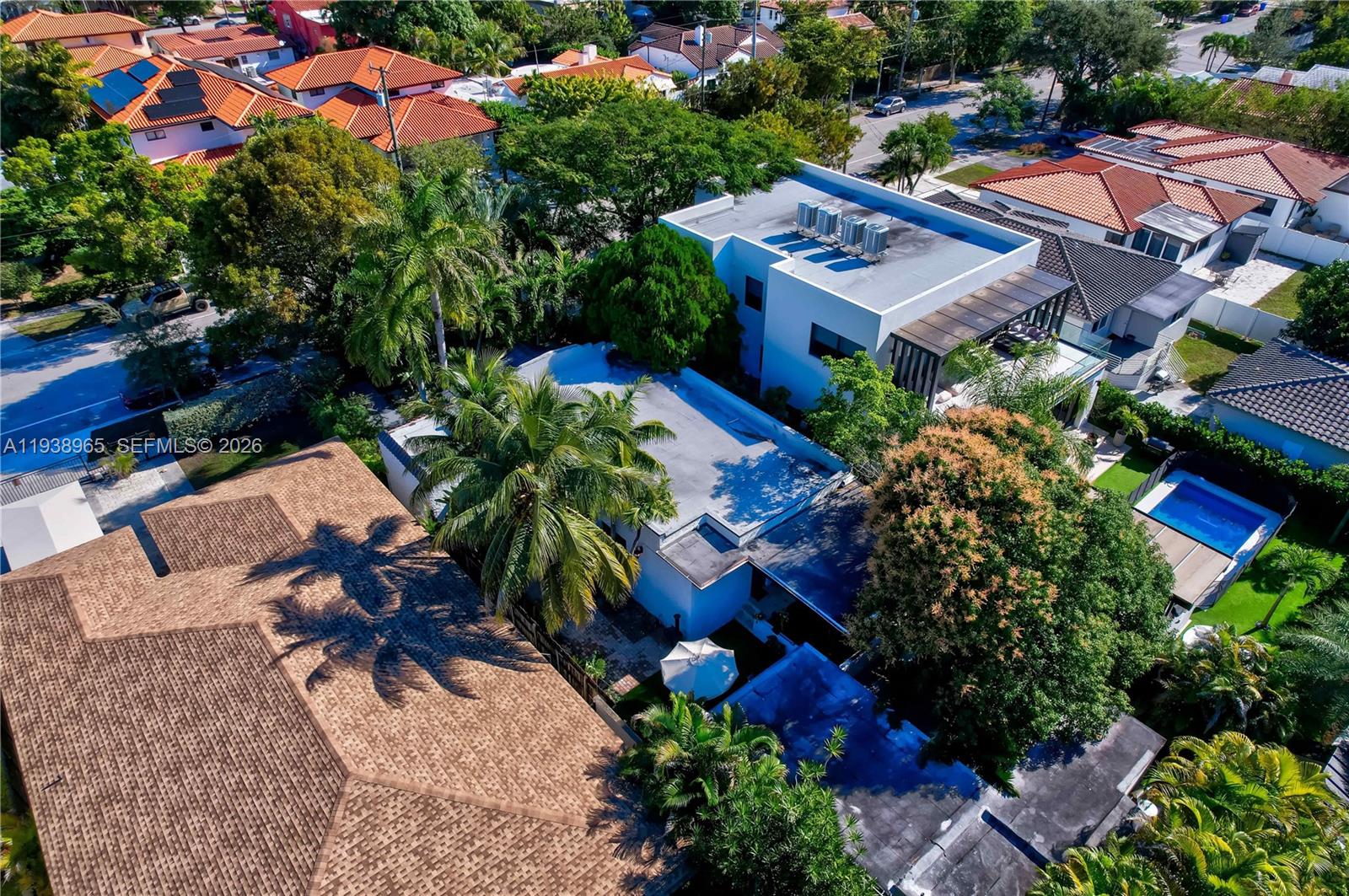 452 Southwest 21st Road Miami, FL 33129 - Photo 50 of 51 an aerial view of a house with a yard and lake view