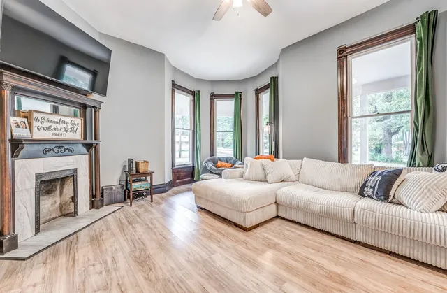 a living room with couches and a fireplace