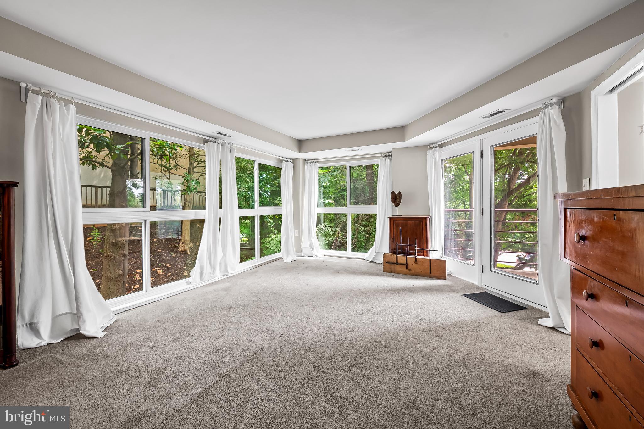 1040 Deer Ridge Drive, Unit 200 Baltimore, MD 21210 - Photo 23 of 38 a view of a room with furniture and a large window