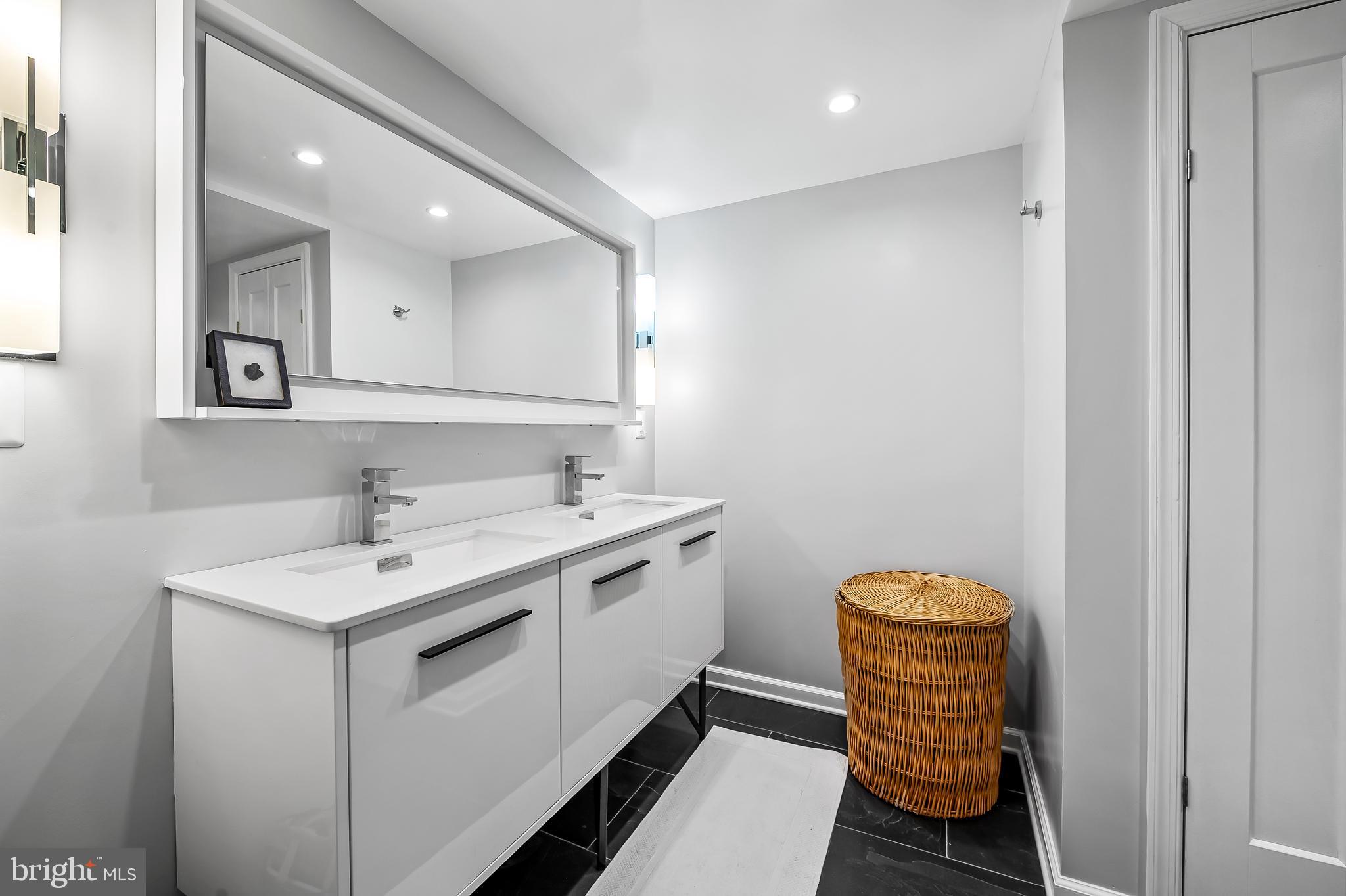 1040 Deer Ridge Drive, Unit 200 Baltimore, MD 21210 - Photo 27 of 38 a utility room with a sink dryer and washer