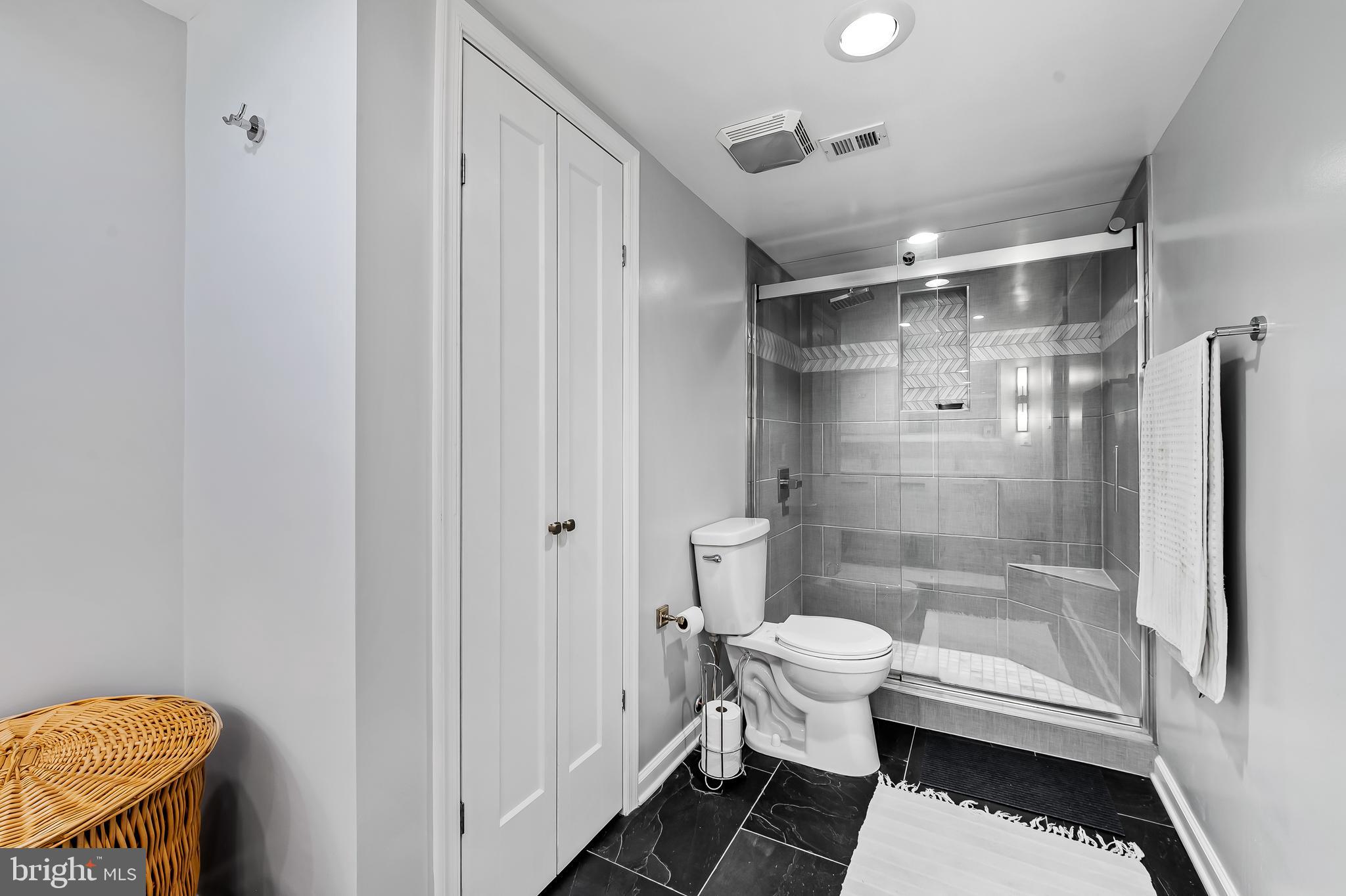 1040 Deer Ridge Drive, Unit 200 Baltimore, MD 21210 - Photo 34 of 38 a bathroom with a sink and a shower