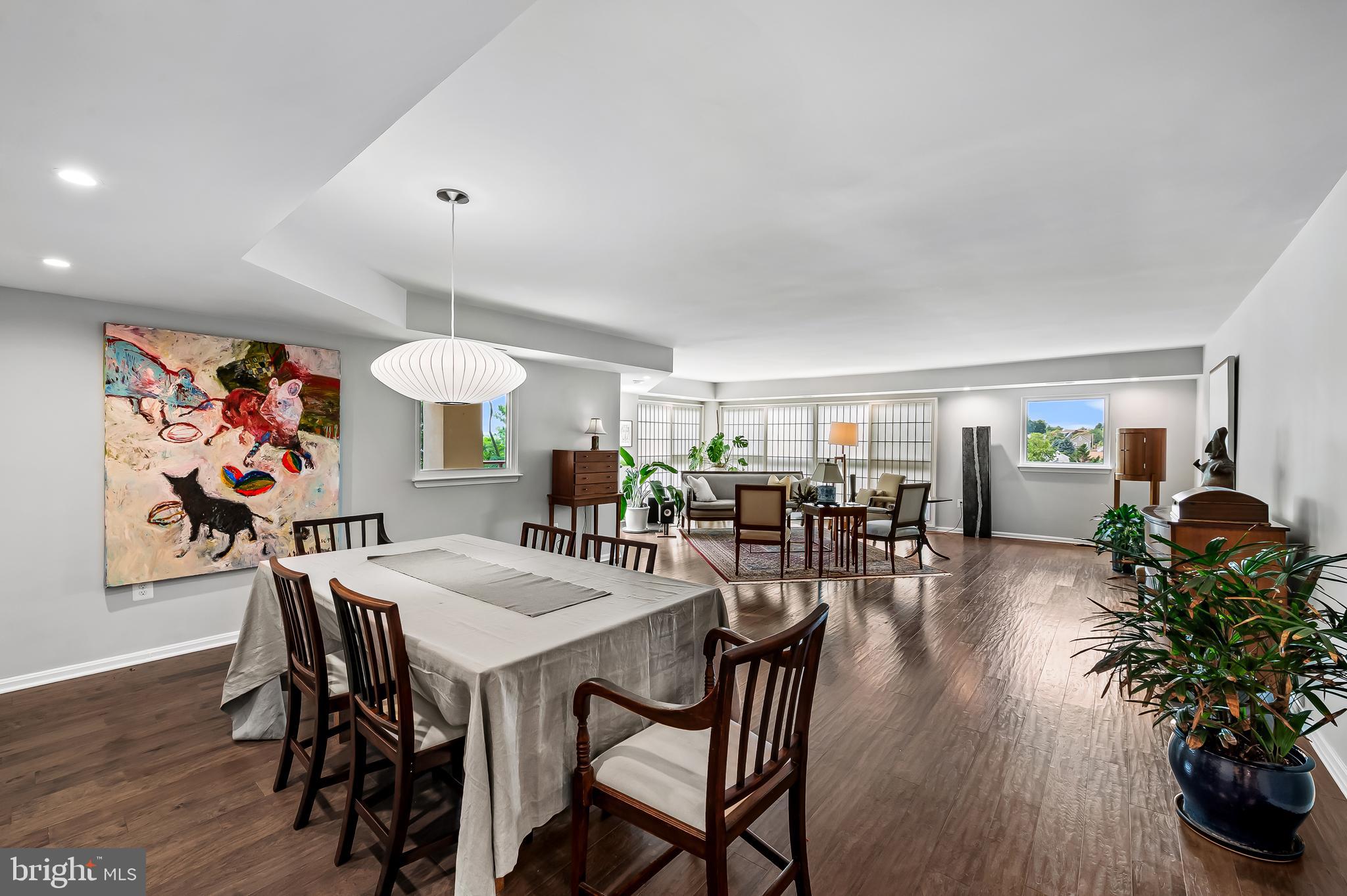 1040 Deer Ridge Drive, Unit 200 Baltimore, MD 21210 - Photo 10 of 38 a view of a dining room with furniture and wooden floor