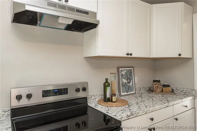 a kitchen with appliances and cabinets