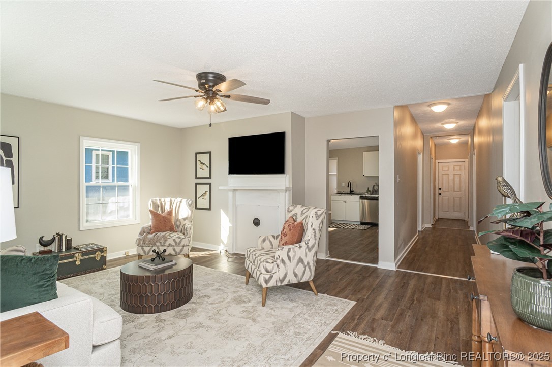 102 North 17th Street Erwin, NC 28339 - Photo 2 of 32 a living room with furniture and a flat screen tv