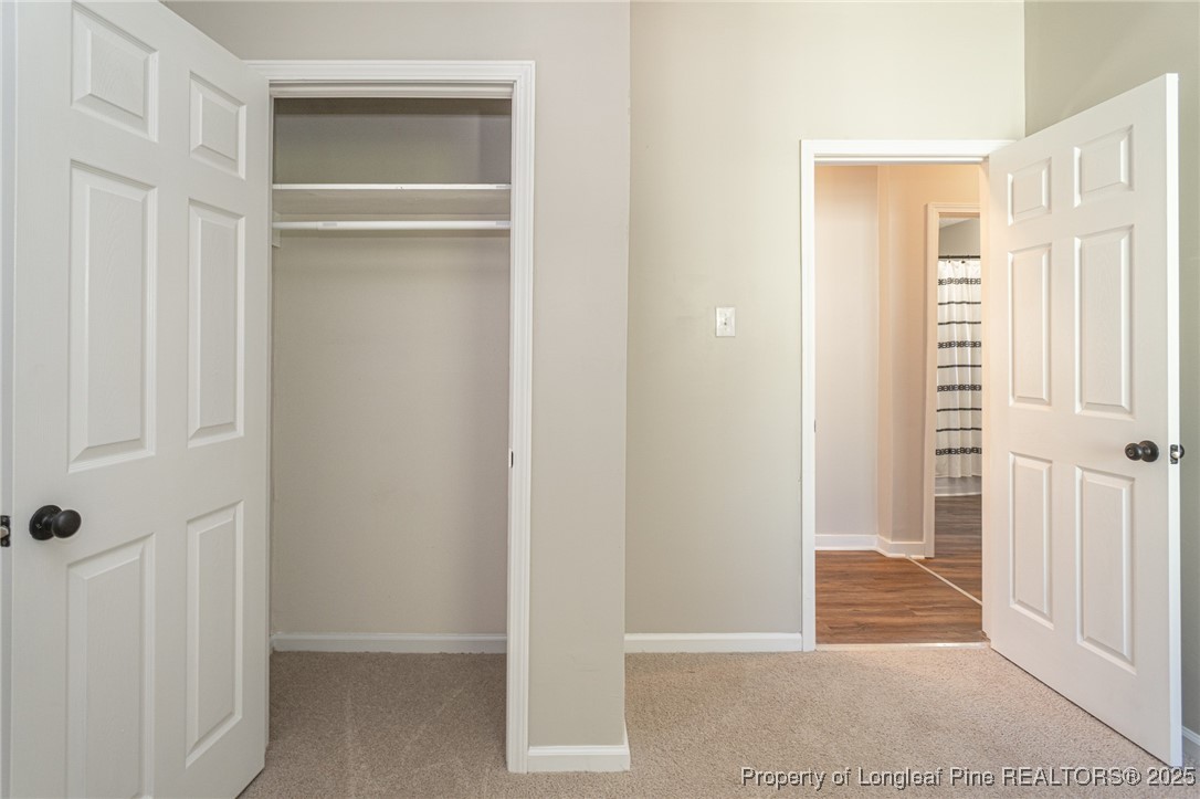 102 North 17th Street Erwin, NC 28339 - Photo 25 of 32 a view of a hallway with wooden floor and closet area