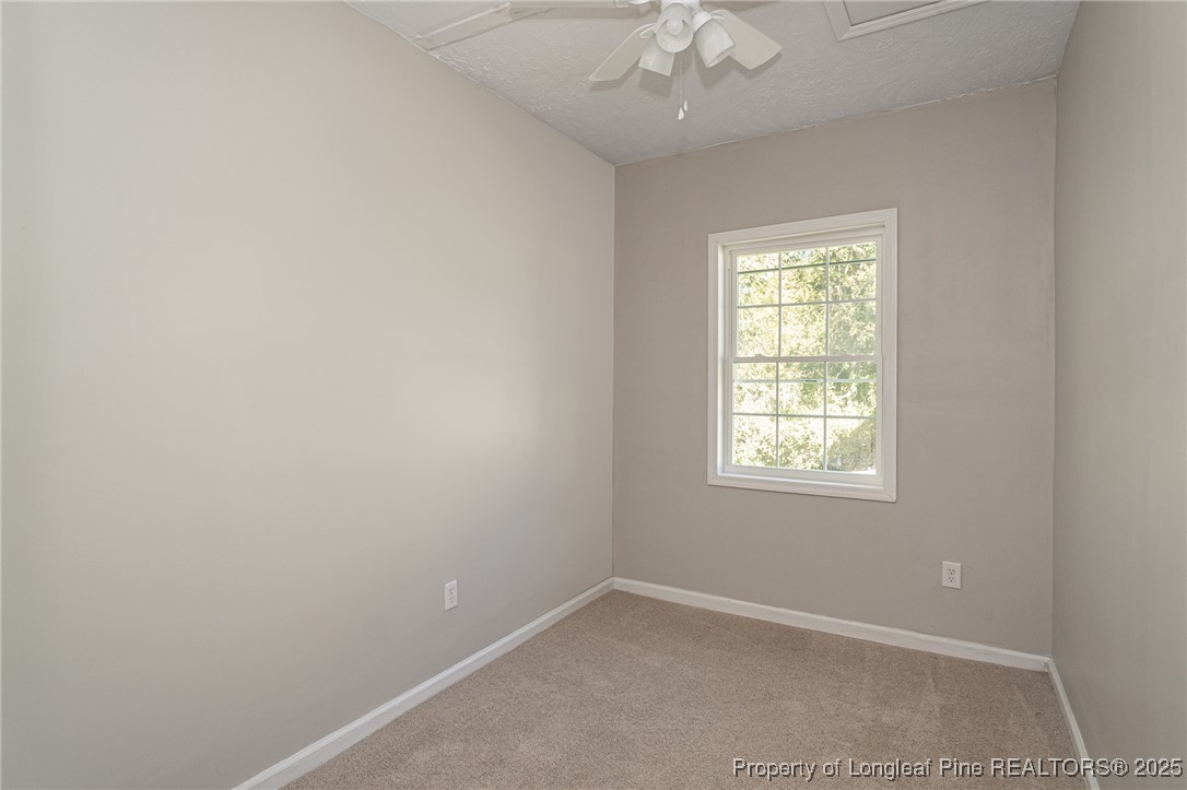 102 North 17th Street Erwin, NC 28339 - Photo 26 of 32 an empty room with a window