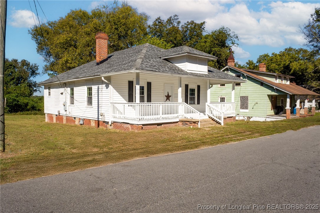 102 North 17th Street Erwin, NC 28339 - Photo 29 of 32 a front view of a house with a yard