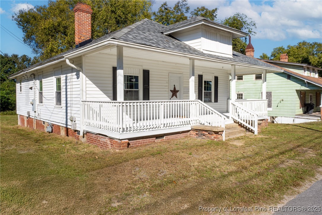 102 North 17th Street Erwin, NC 28339 - Photo 30 of 32 a view of a house with a wooden deck