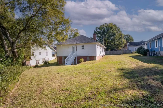 a view of a yard with a small house