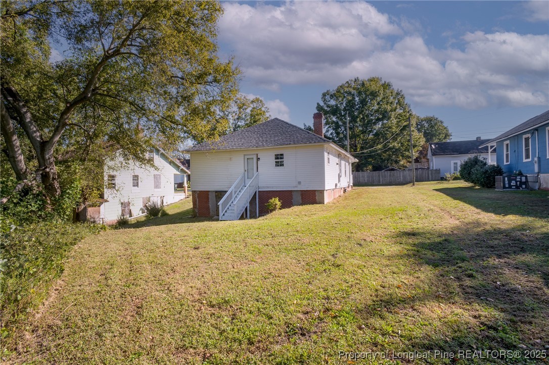102 North 17th Street Erwin, NC 28339 - Photo 31 of 32 a large house with a large tree in front of it