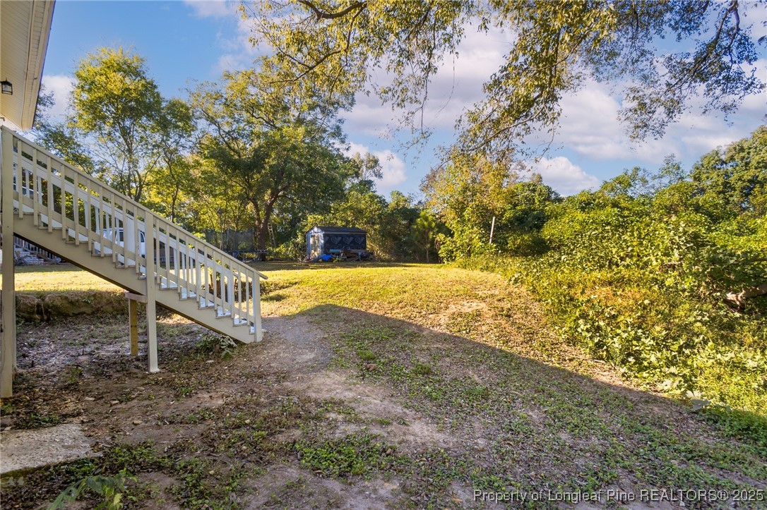 102 North 17th Street Erwin, NC 28339 - Photo 32 of 32 a view of a yard with a small house