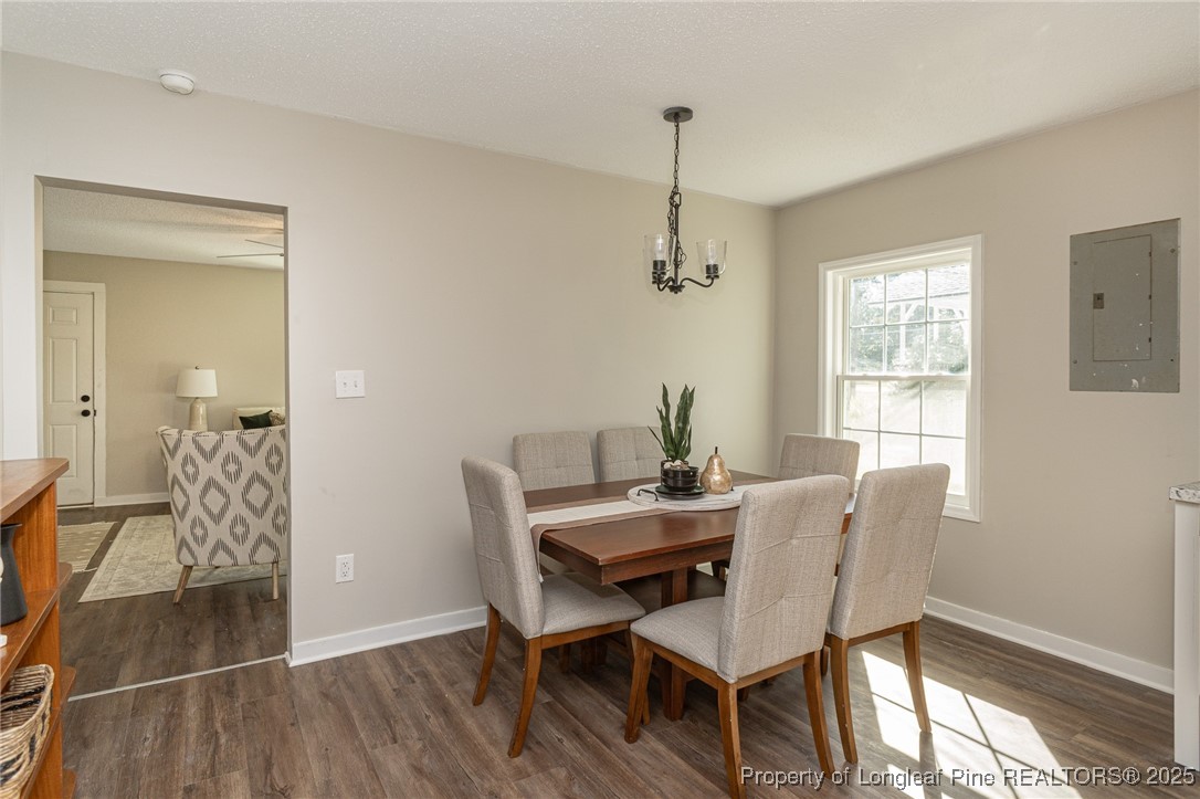 102 North 17th Street Erwin, NC 28339 - Photo 7 of 32 a view of a dining room with furniture window and wooden floor
