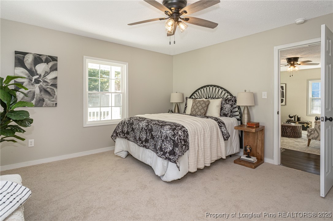 102 North 17th Street Erwin, NC 28339 - Photo 10 of 32 a bedroom with a bed and a window