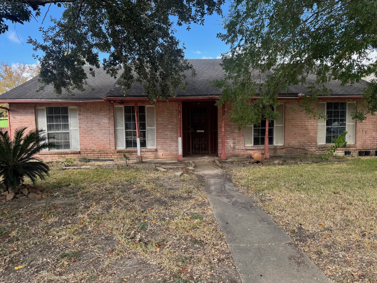 15950 Chimney Rock Road Houston, TX 77489 - Photo 2 of 7 front view of a house with a yard