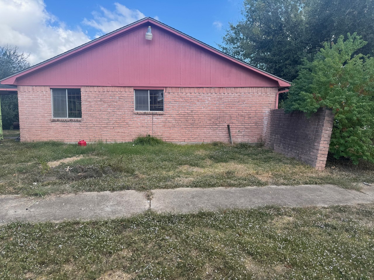 15950 Chimney Rock Road Houston, TX 77489 - Photo 7 of 7 a front view of a house with a yard and garage