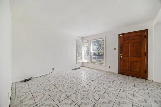 a view of an empty room and window