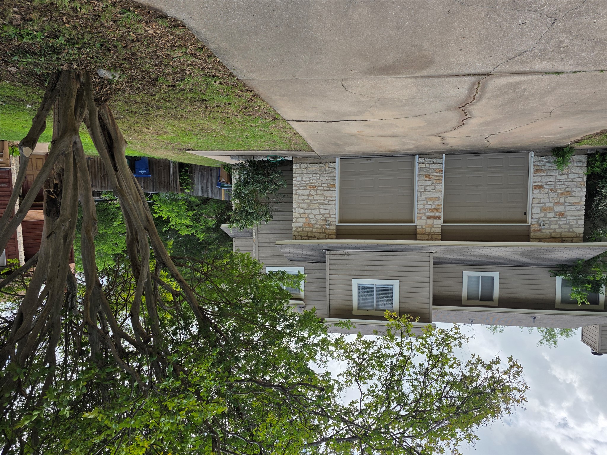 8818 Clearbrook Trail Austin, TX 78729 - Photo 3 of 22 Unit A Entrance is on the Right side, with mature Crepe Myrtle on front.