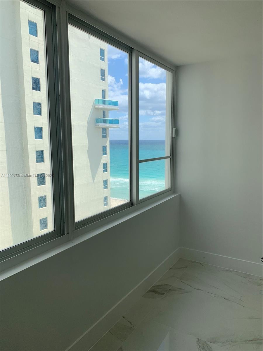 5005 Collins Avenue, Unit 1423 Miami Beach, FL 33140 - Photo 2 of 8 a view of empty room with window