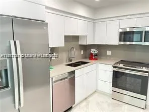 a kitchen with a stove and a microwave