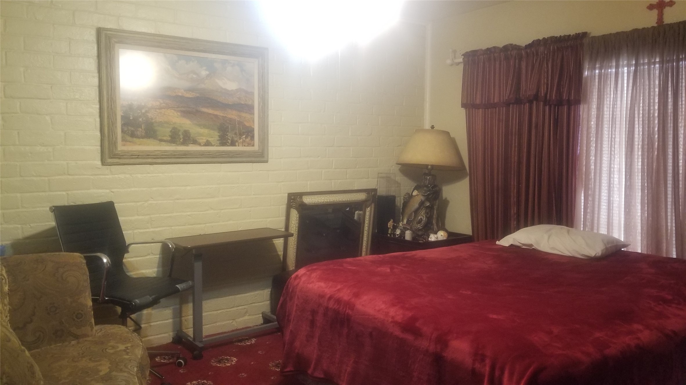 7267 Cook Road Houston, TX 77072 - Photo 7 of 10 a bedroom with a bed and a chair