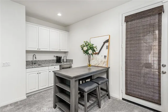 a room with a table and chairs in it