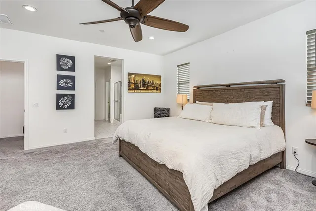 a bedroom with a bed and wall painting