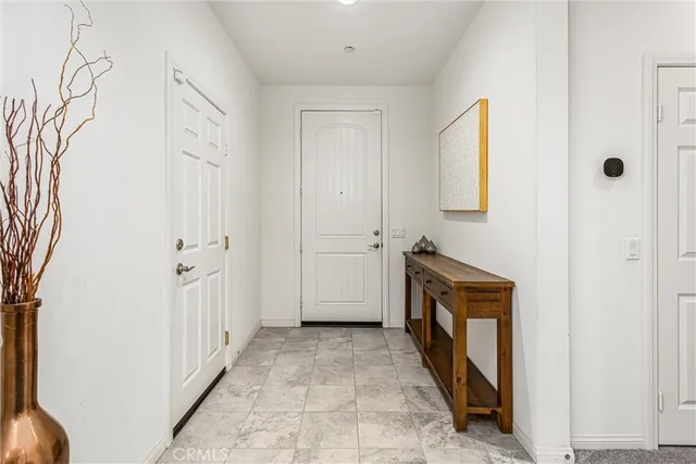 a view of a hallway with washer and dryer