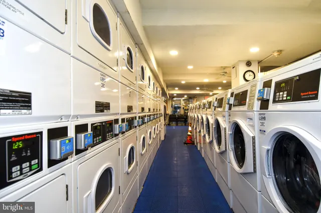 a view of a hallway with washer and dryer