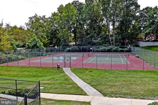 a view of yard with swimming pool and seating area