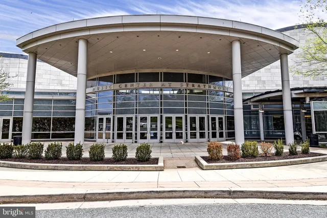 a view of a house and a yard