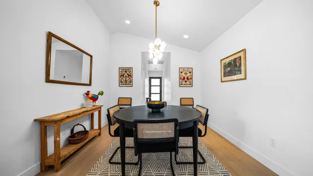 a dining room with furniture and window